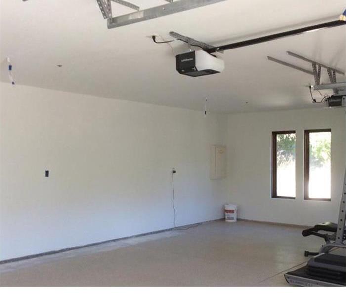 empty room with white walls and a window to the far right