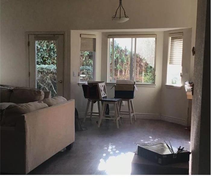 3 chairs with boxes on top of it in the living room.