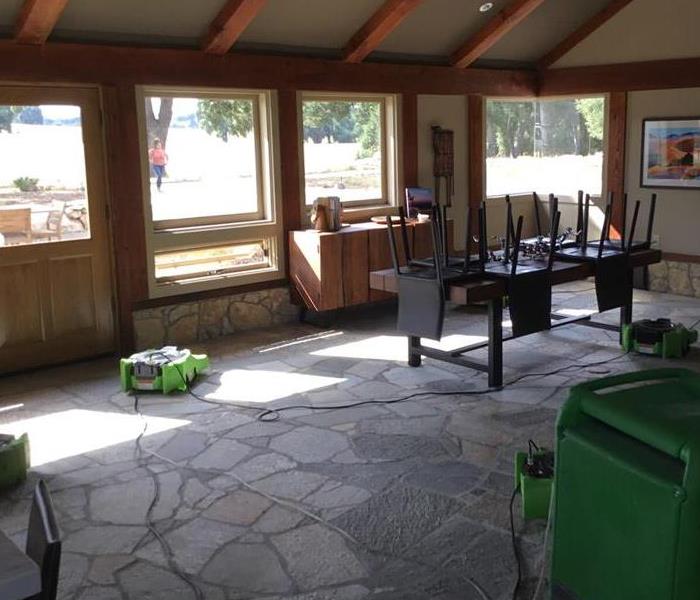 green machines scattered throughout the tile floor.