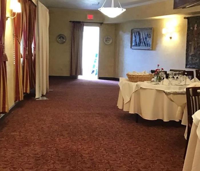 dining area in a restaurant with tables and lamps inside